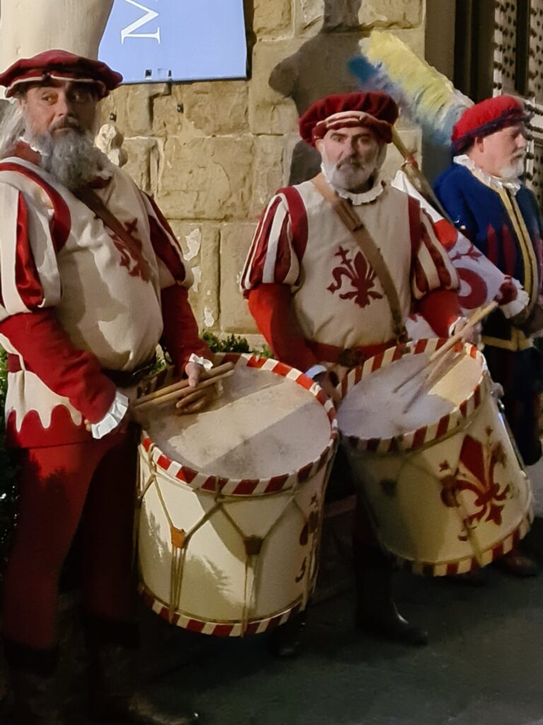 Sbandieratori drummers in traditional medieval costumes performing in Florence