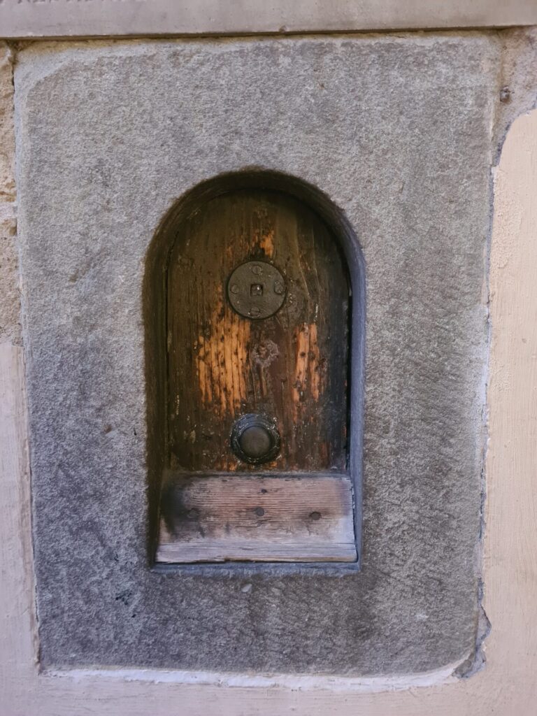 Historic wine window in Florence wall used to serve wine