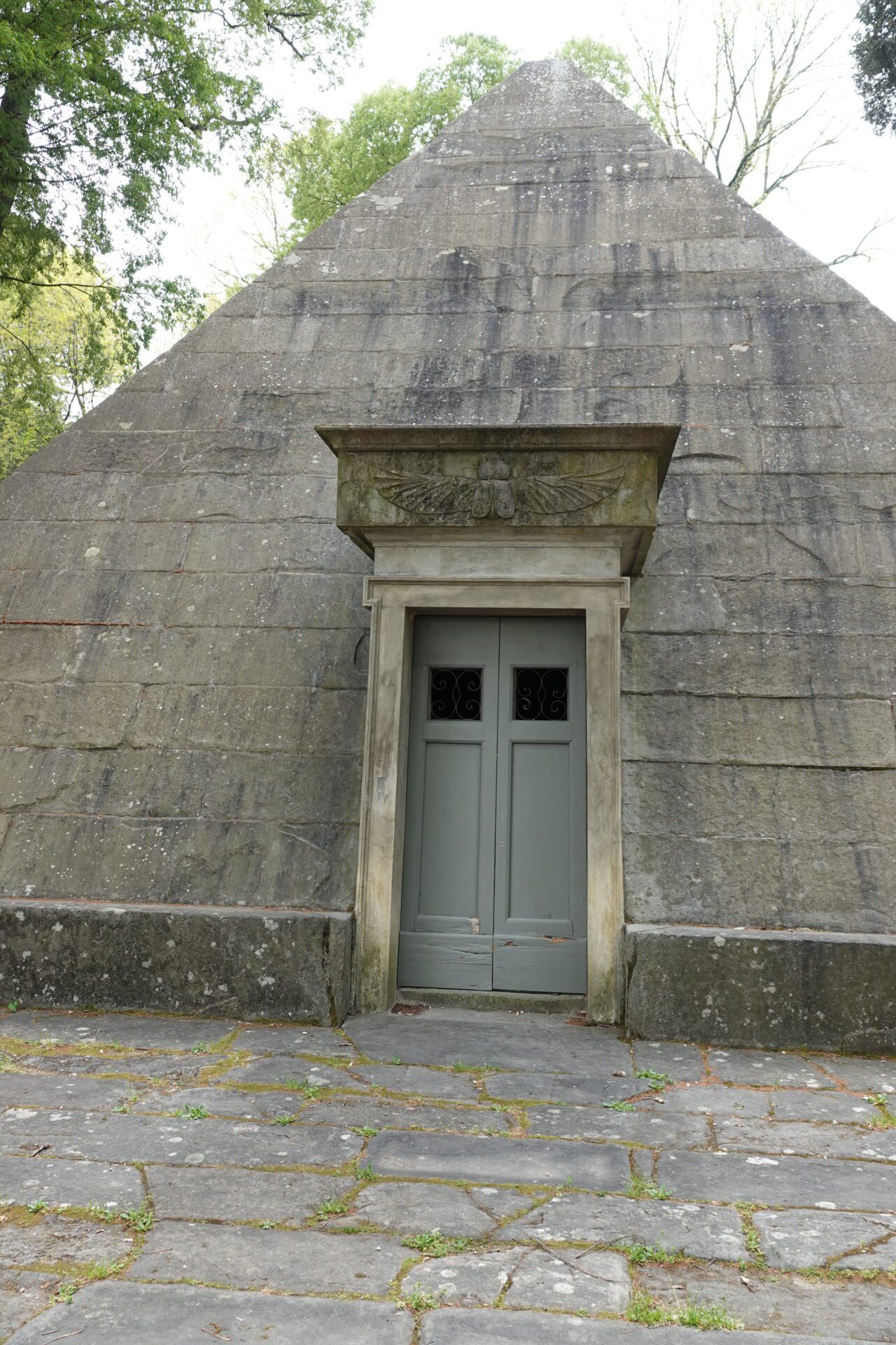 Entrance door of the Ghiacciaia delle Cascine Florence with stone frame and historic details